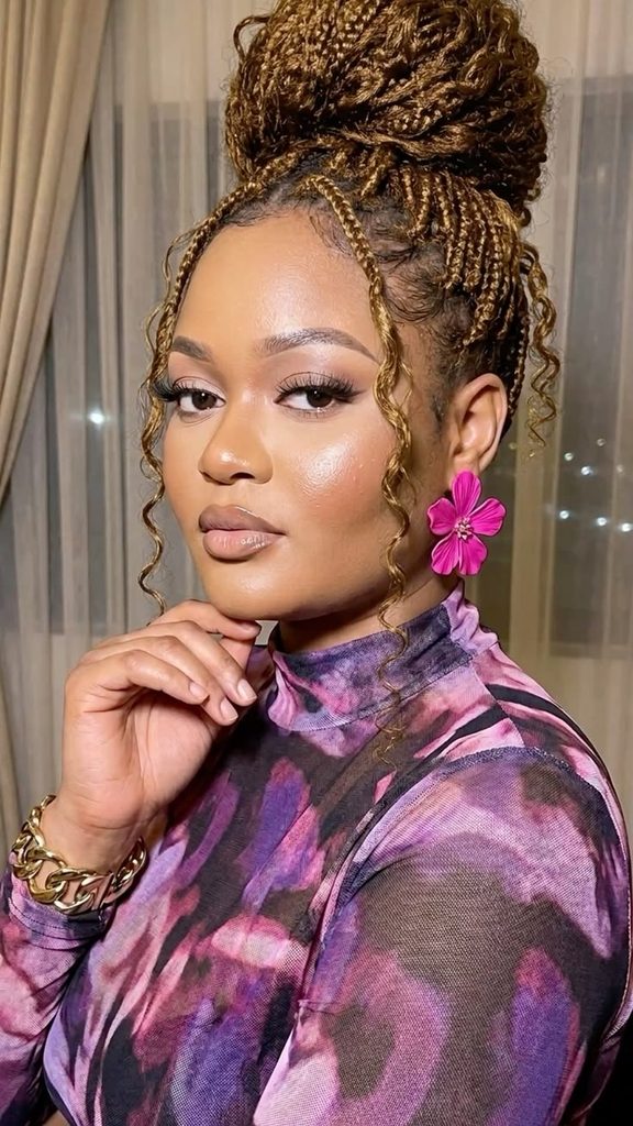 someone with french braids updo