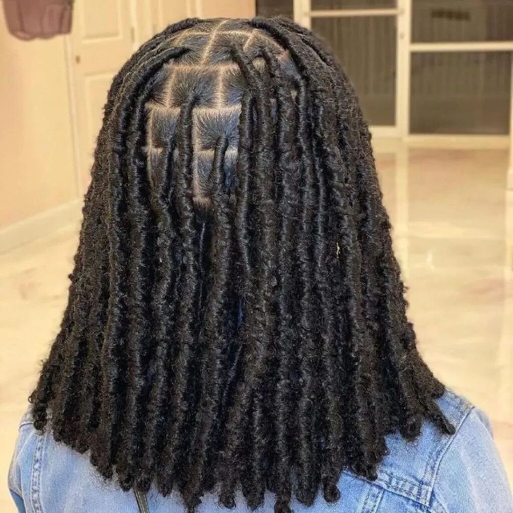 someone with goddess locs as protective styles for length retention