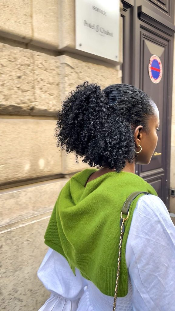 someone with half up half down curls date night hairstyle for afro hair