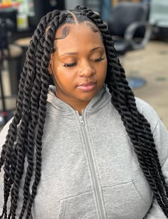 someone with Havana twists as protective styles for length retention
