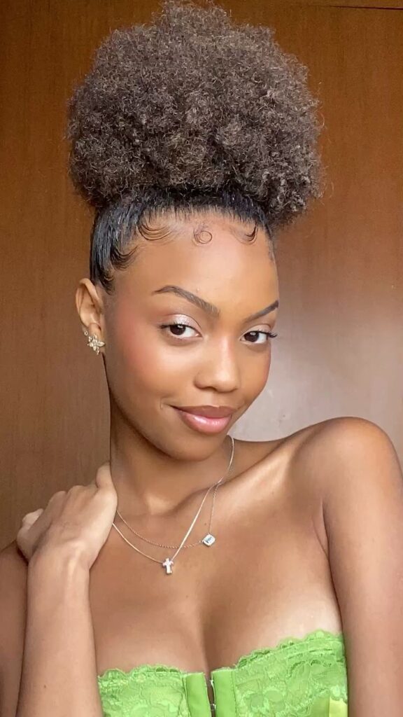 someone with high bun hair