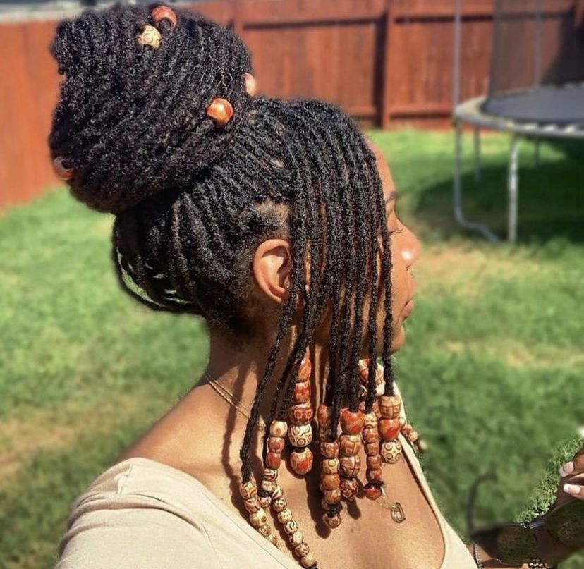 someone with loc updo with beads