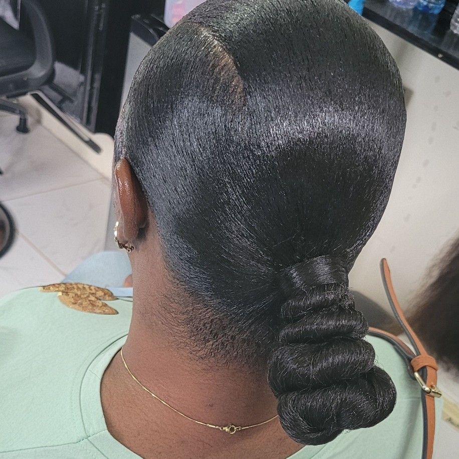 someone with low ponytail with silk