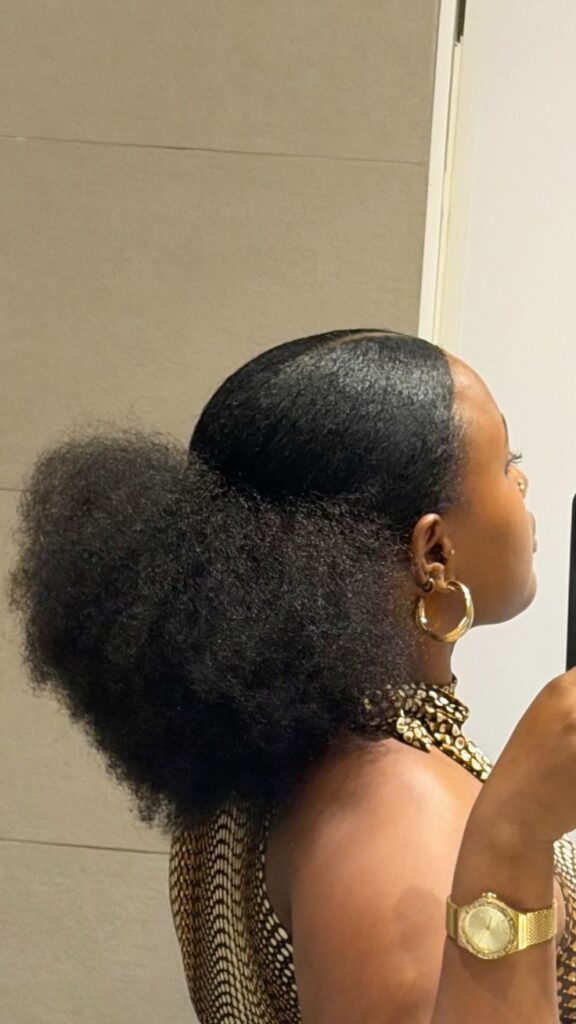 someone with low puff style for natural hair