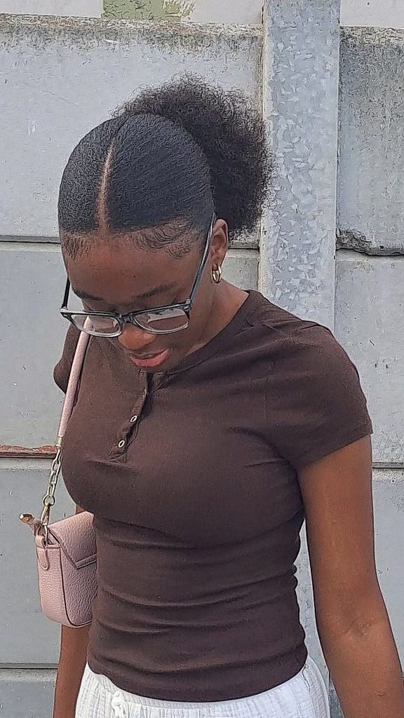 someone with low puff with a middle part date night hairstyle for afro hair