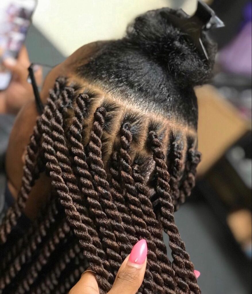 someone with Marley twists as protective styles for length retention