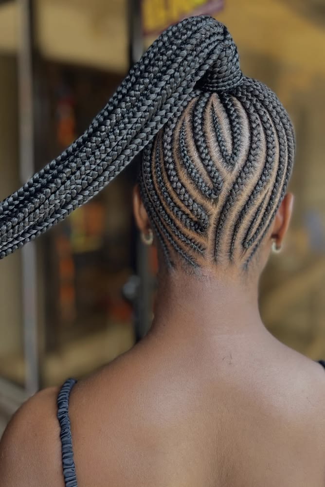 someone with neat cornrows updo hairstyle for the office