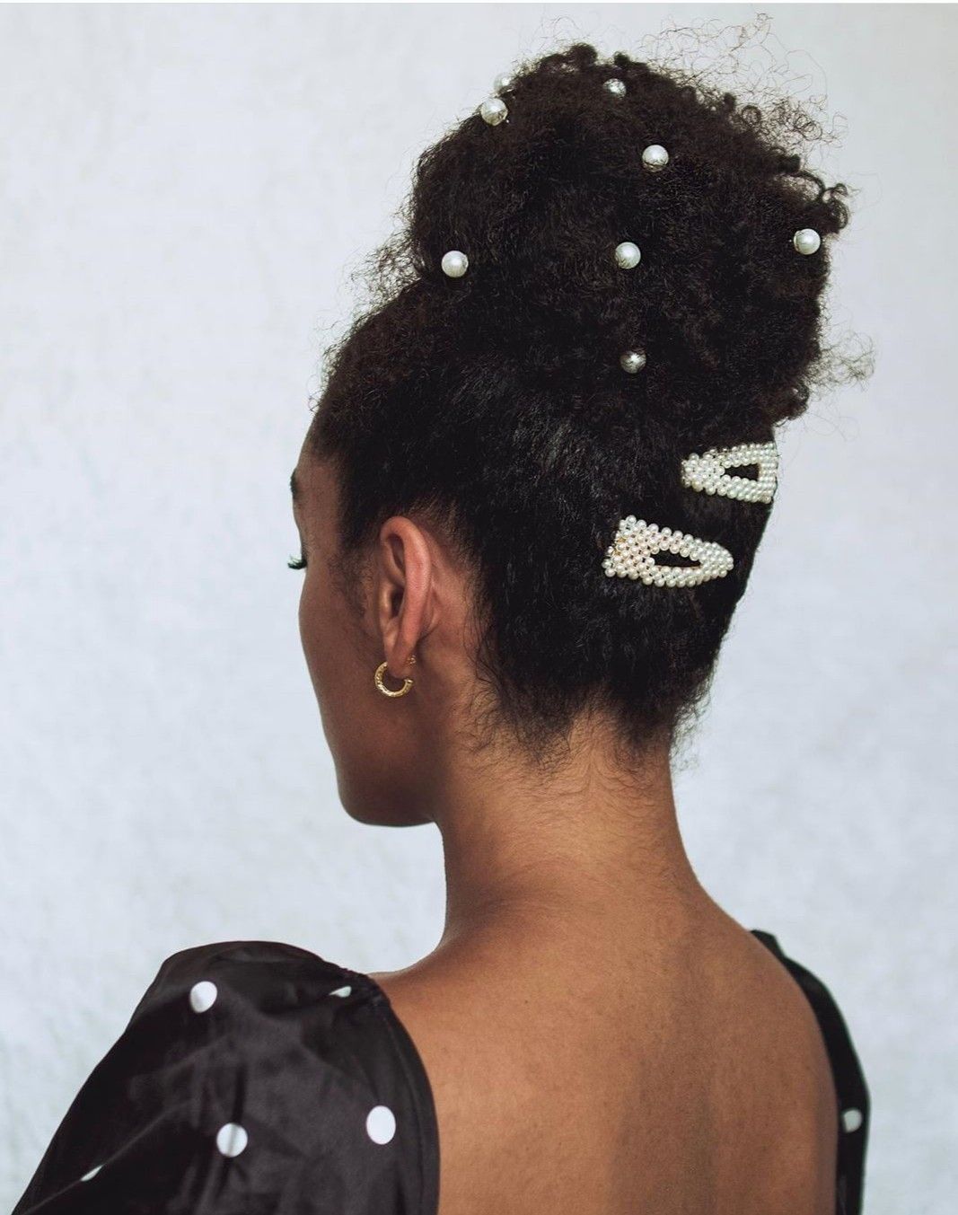 someone with pearl pinned updo