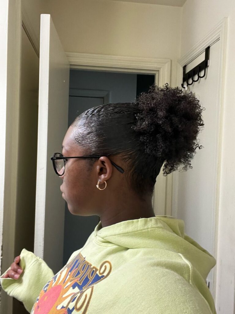 someone with puff finish with shine spray