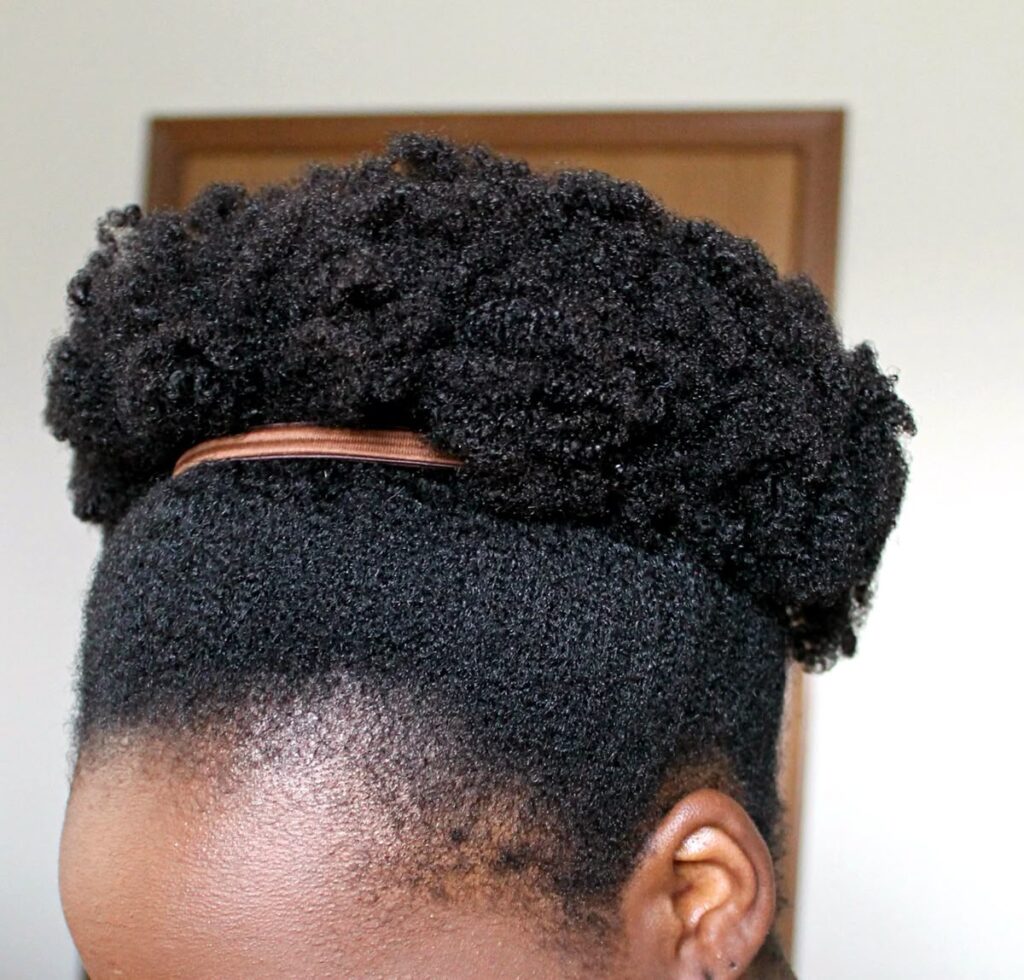 someone with puff on short hair