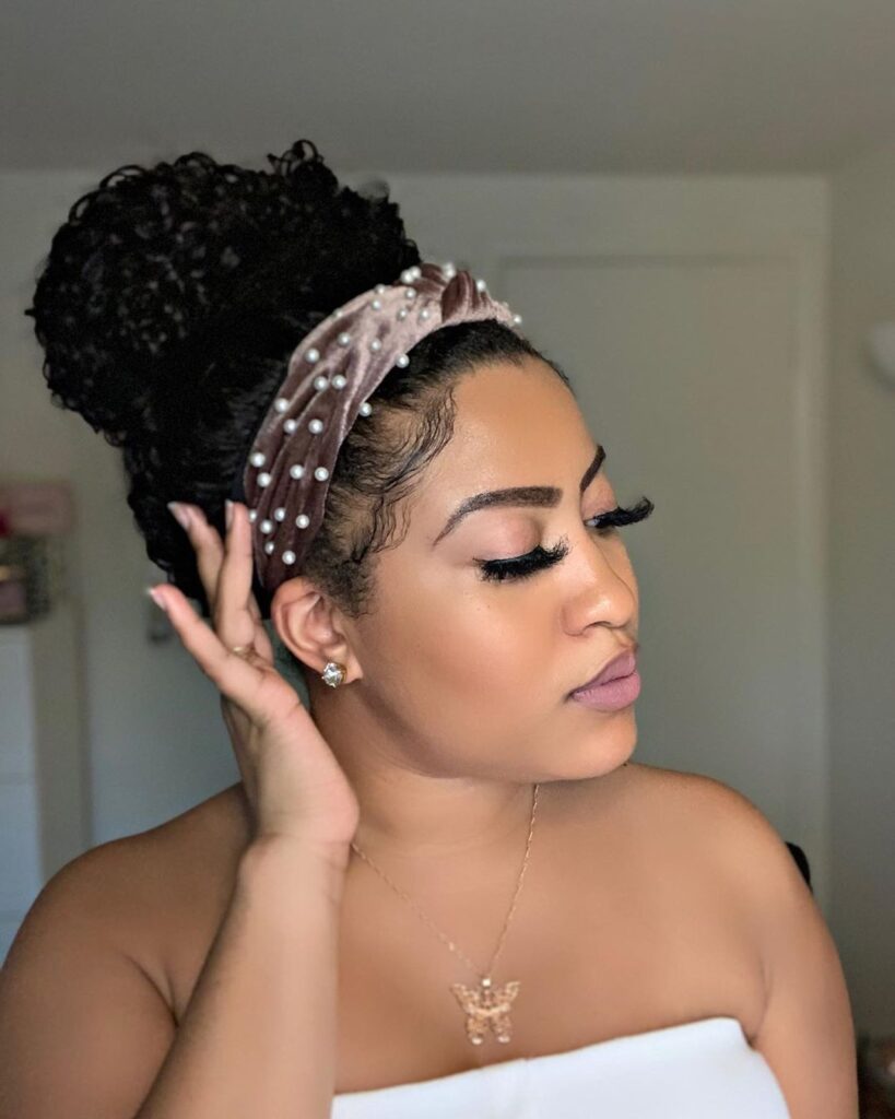 someone with puff with sequins headband