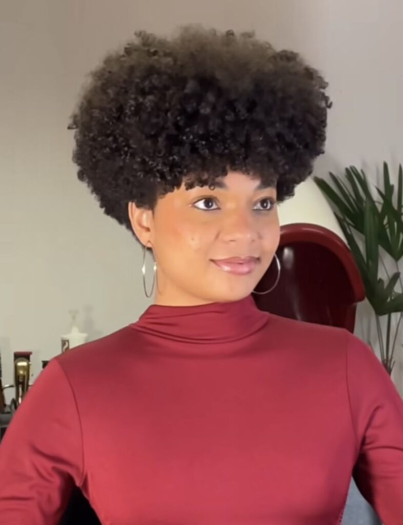 someone with rounded tapper natural afro