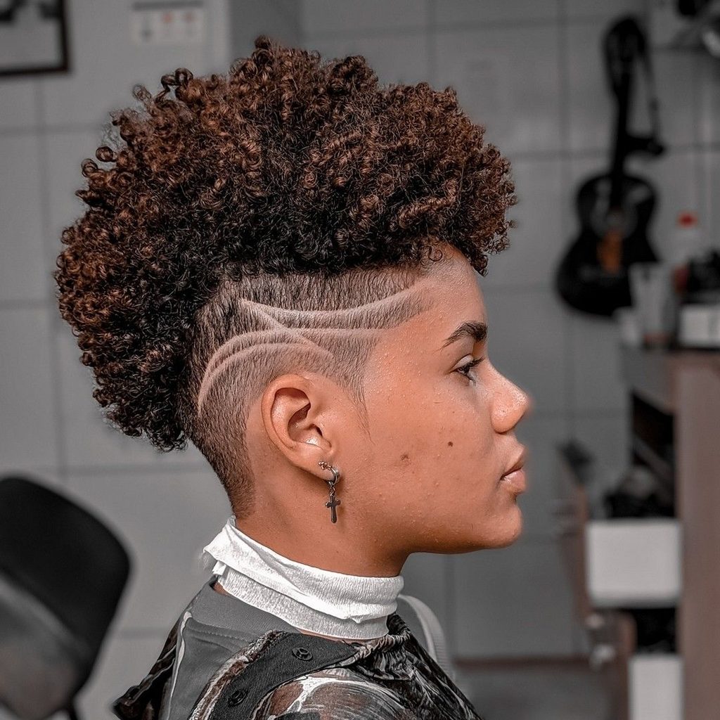 someone with sculpted afro weith side shave