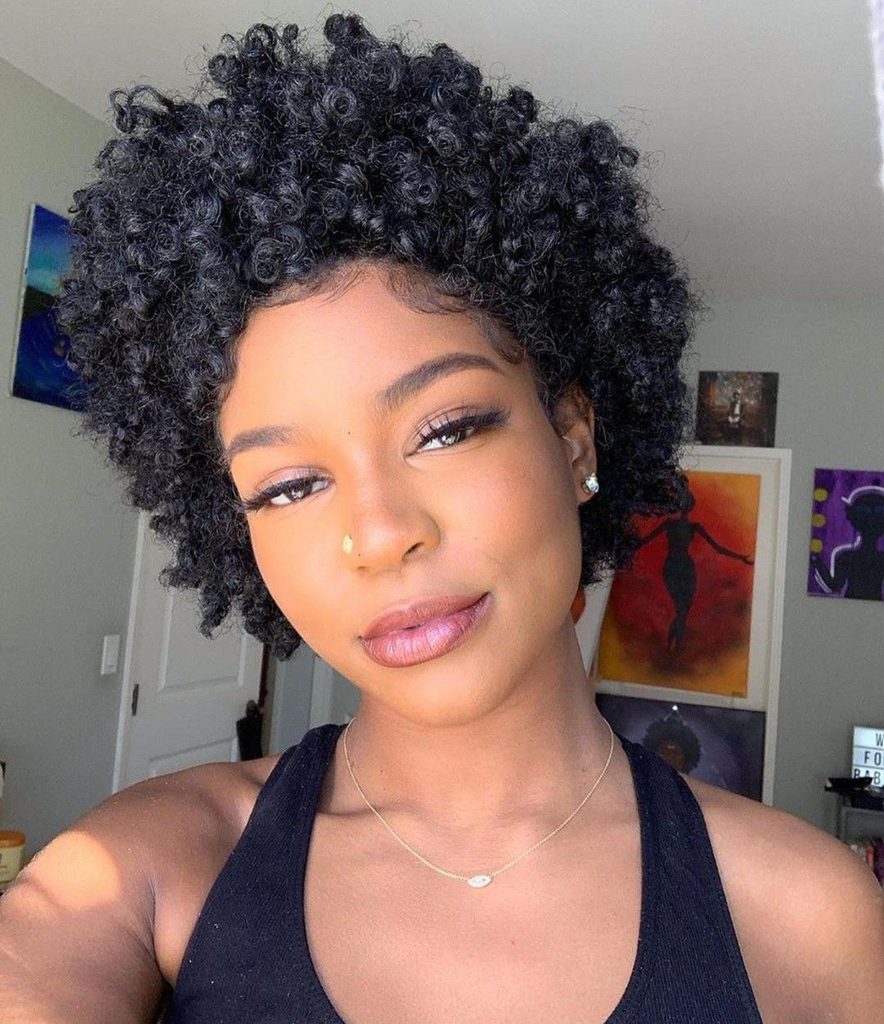 someone with short afro with defined front curls