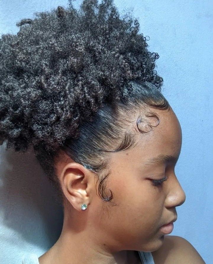 someone with sleek afro with edge control professional hairstyle for the office