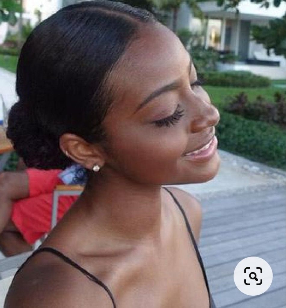 someone with sleek middle part
