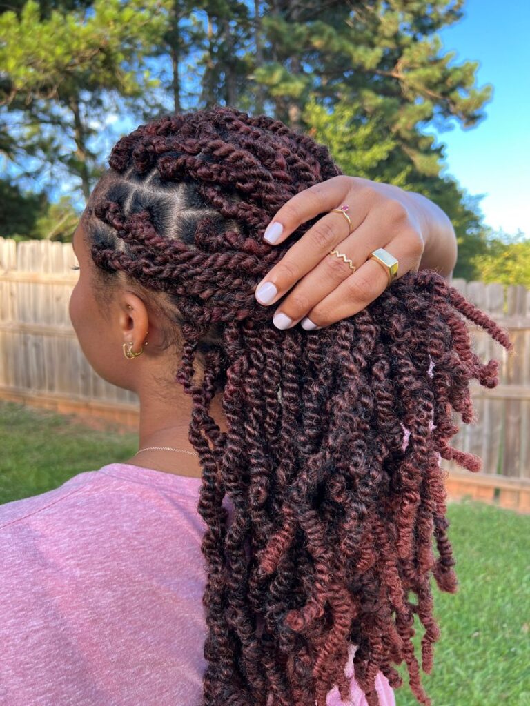 someone with spring twists as protective styles for length retention