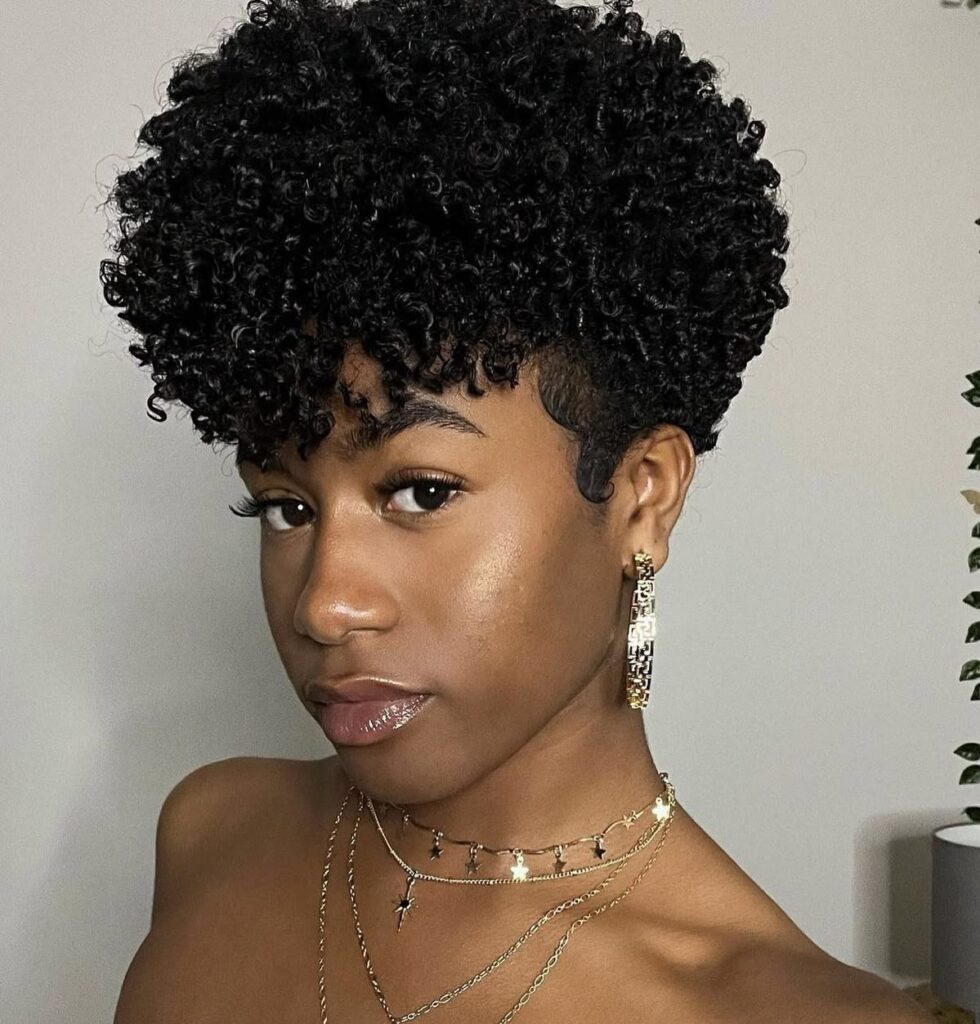 someone with tapered afro cut hairstyle