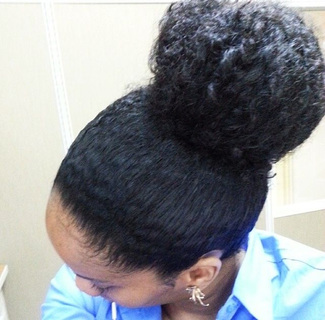 someone with twist out high bun