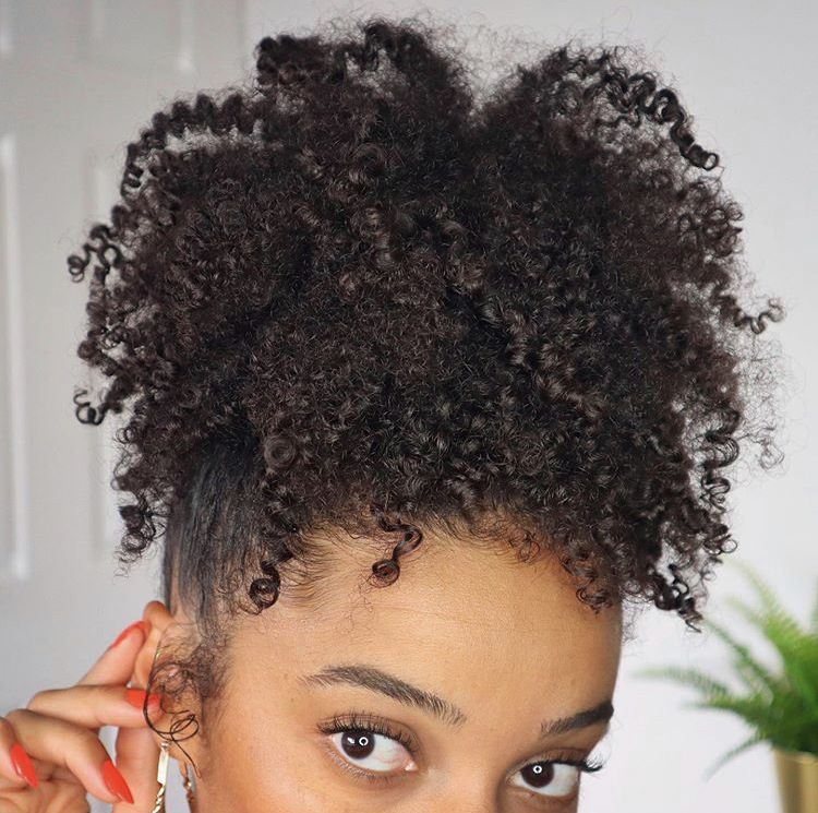 someone with twist out pineapple puff
