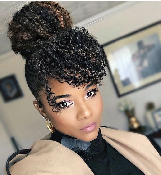 someone with twist out updo afro wedding hairstyle