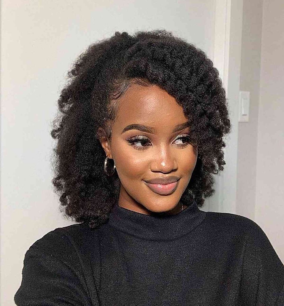 someone with twist out updo hairstyle for the office