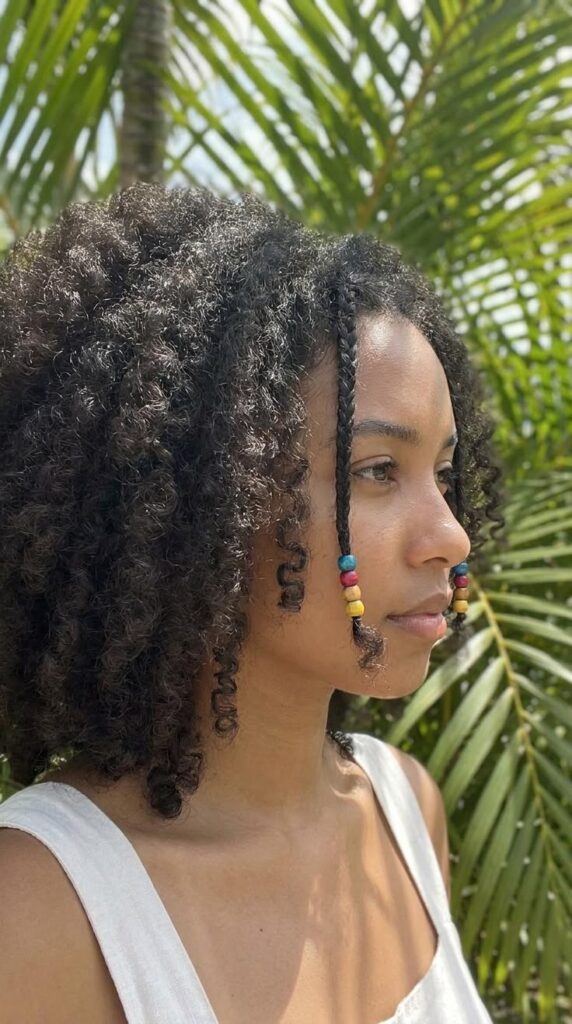 someone with twist out with beads