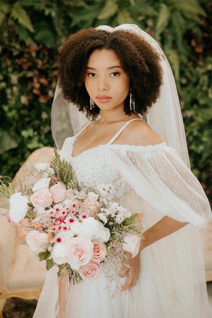 someone with twist out with bridal veil