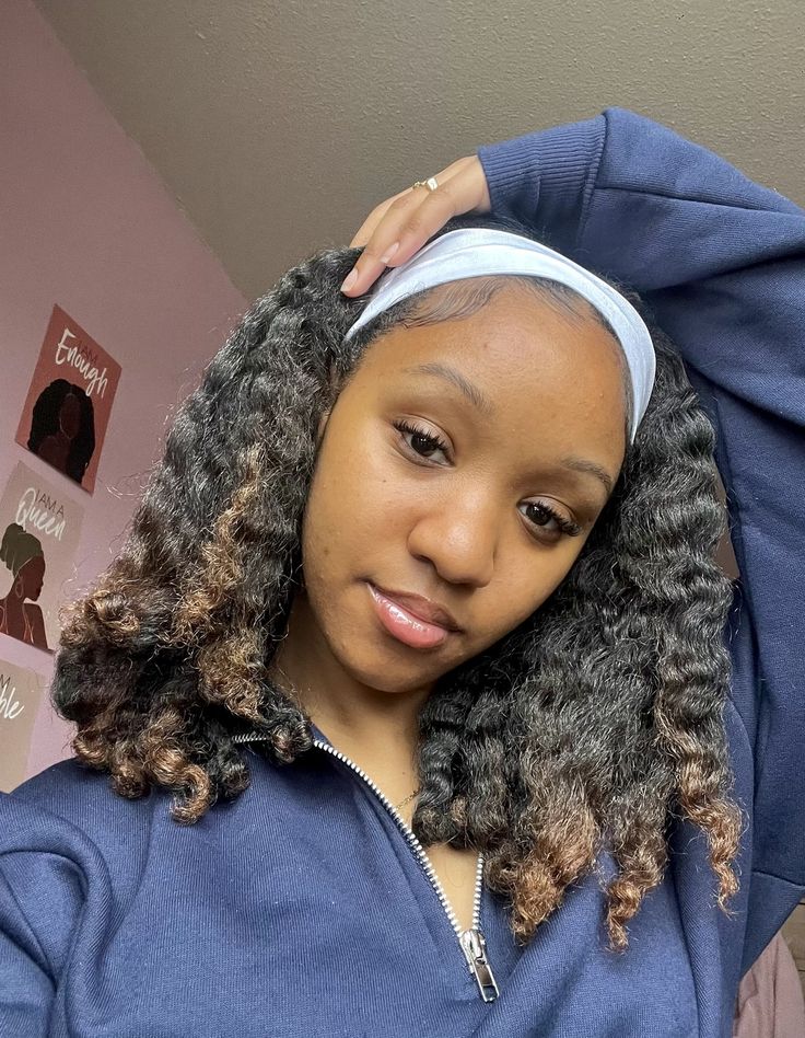 someone with twist out with headband