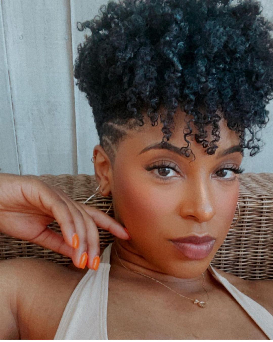 someone with twist out with side shave