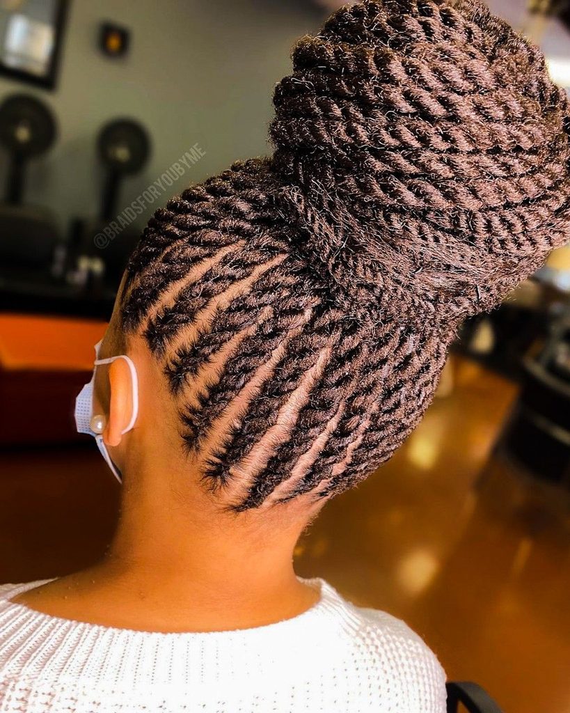 someone with twisted updo with extension afro wedding hairstyle