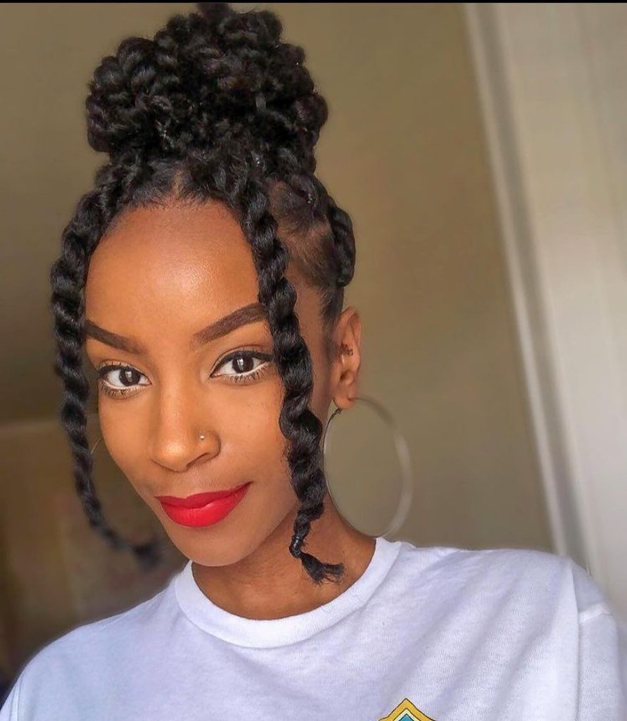 someone with two strand twist updo hairstyle for the office