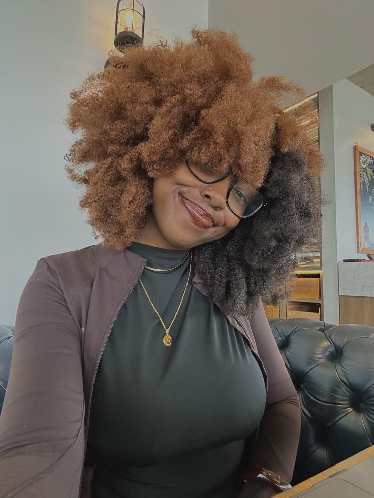 someone with two tone afro hairstyle