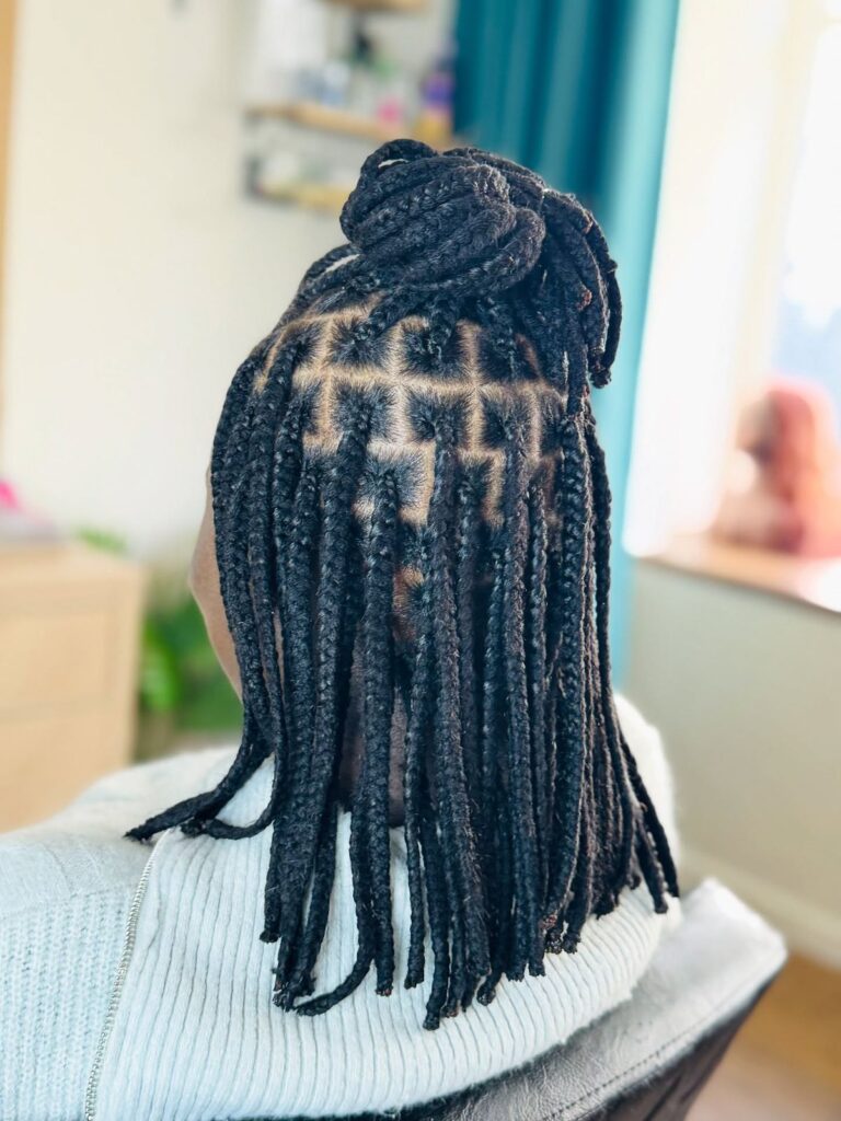 someone with yarn braids