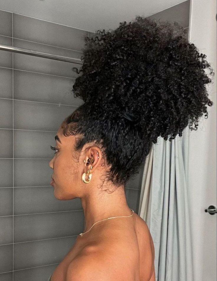 a girl with full puff natural hair