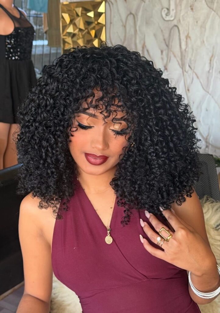 someone with short curly wig