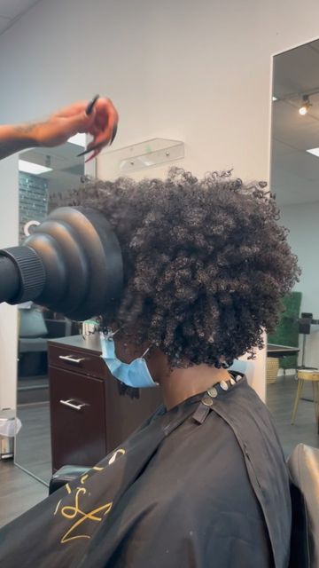 someone drying hair with diffuser