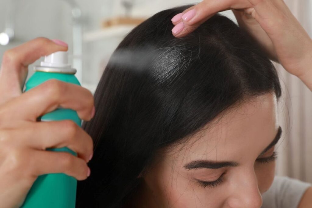 someone cleansing her hair to protect her afro hair under wig
