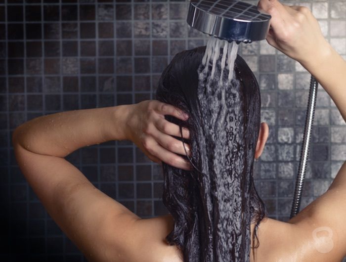 someone rinsing her hair