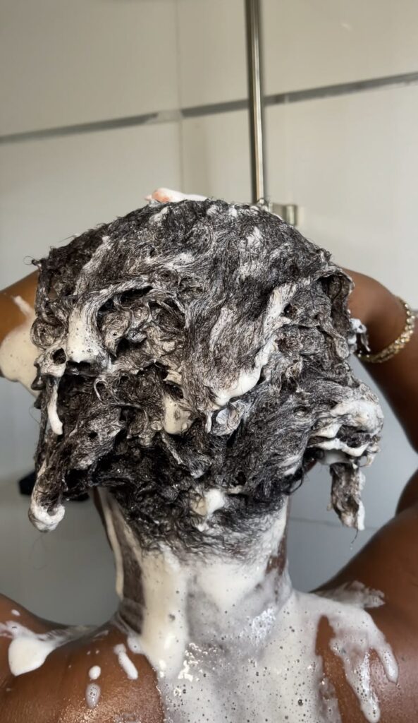 someone washing her hair