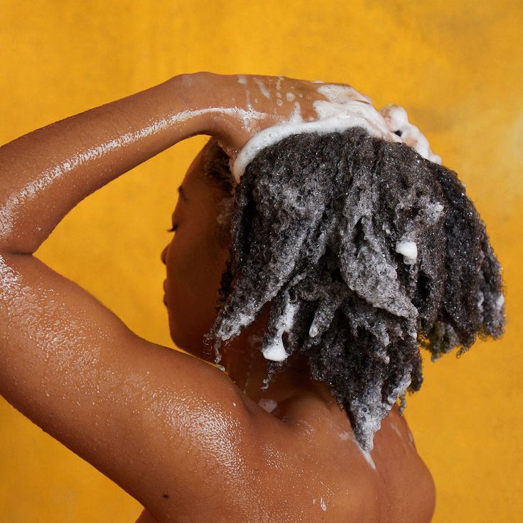 someone washing her hair