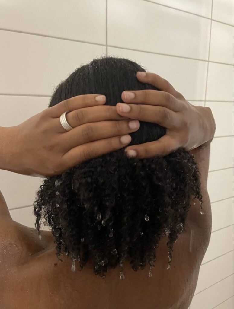 someone rinsing her hair