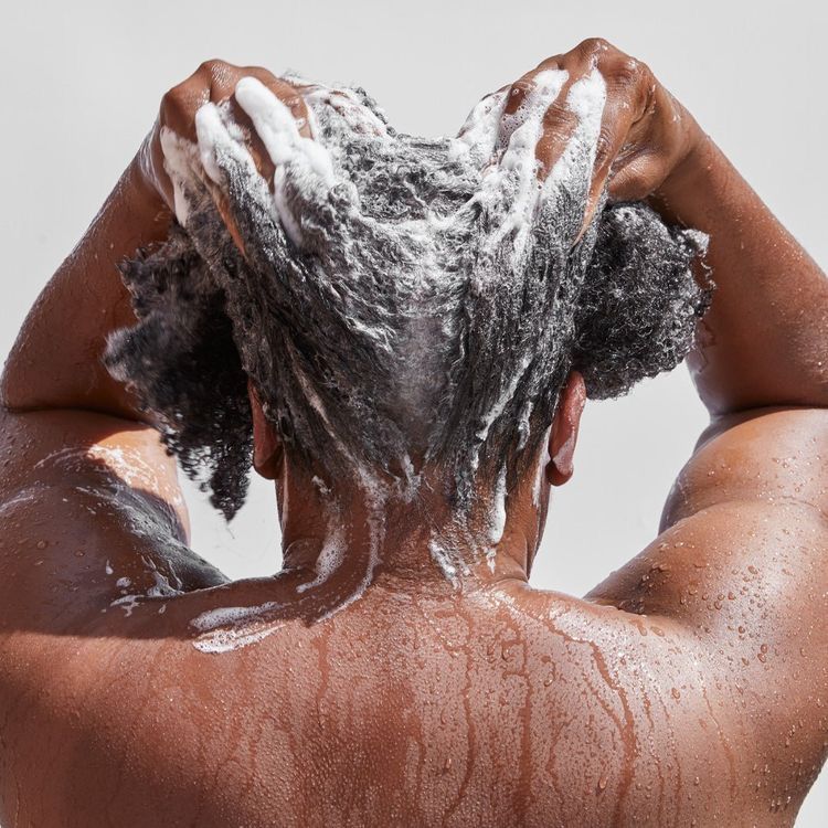 someone washing her hair on her wash day