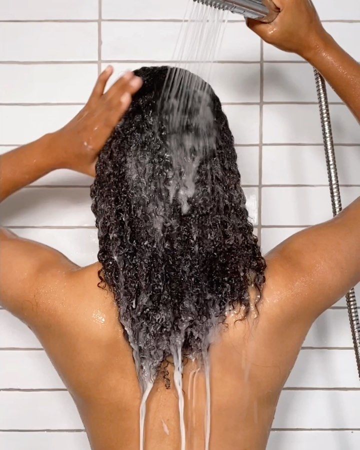 someone washing her hair