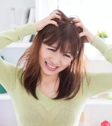 someone with an itchy scalp
