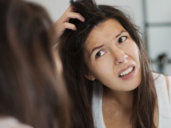someone having an itchy scalp