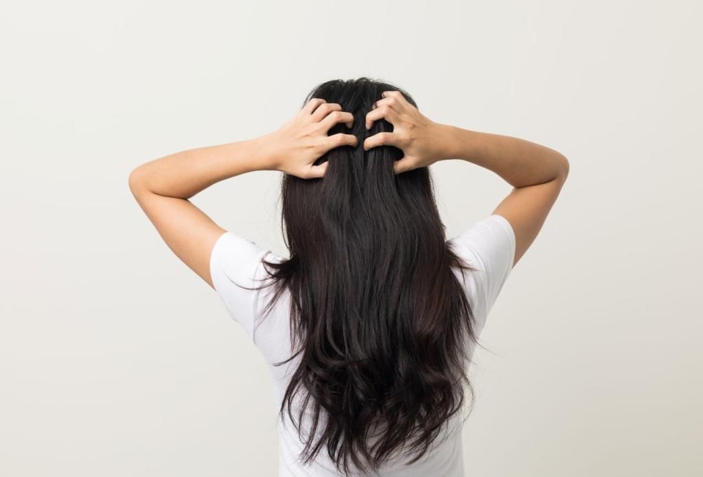 someone wearing itchy wig as one of the scalp mistakes that slow hair growth