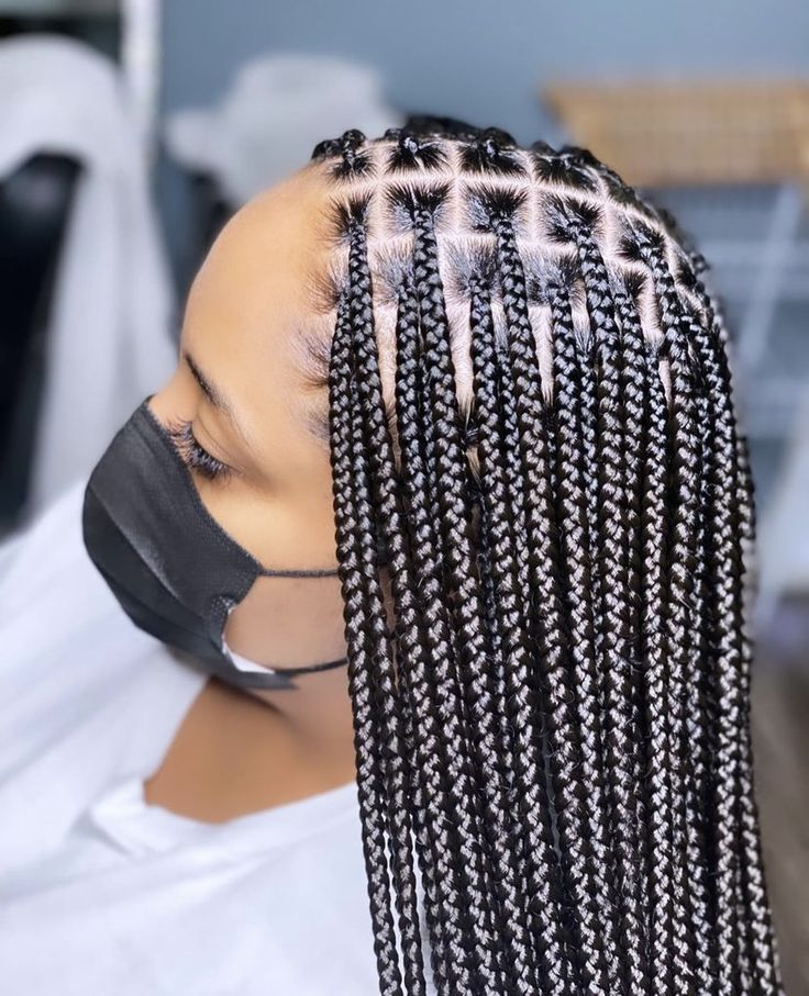 someone with knotless braid as protective styles for length retention