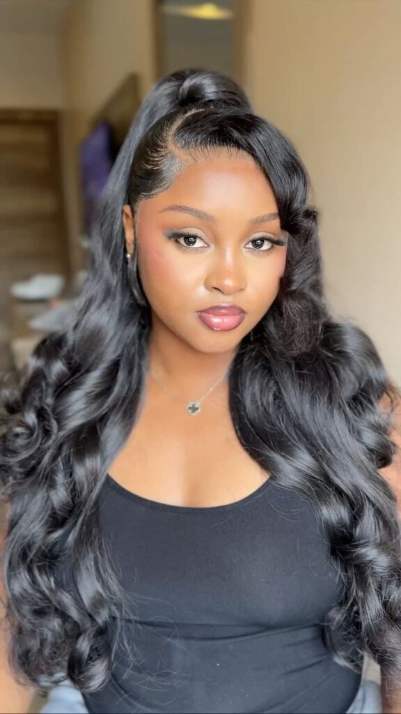 someone with a long bouncy wig for natural hair