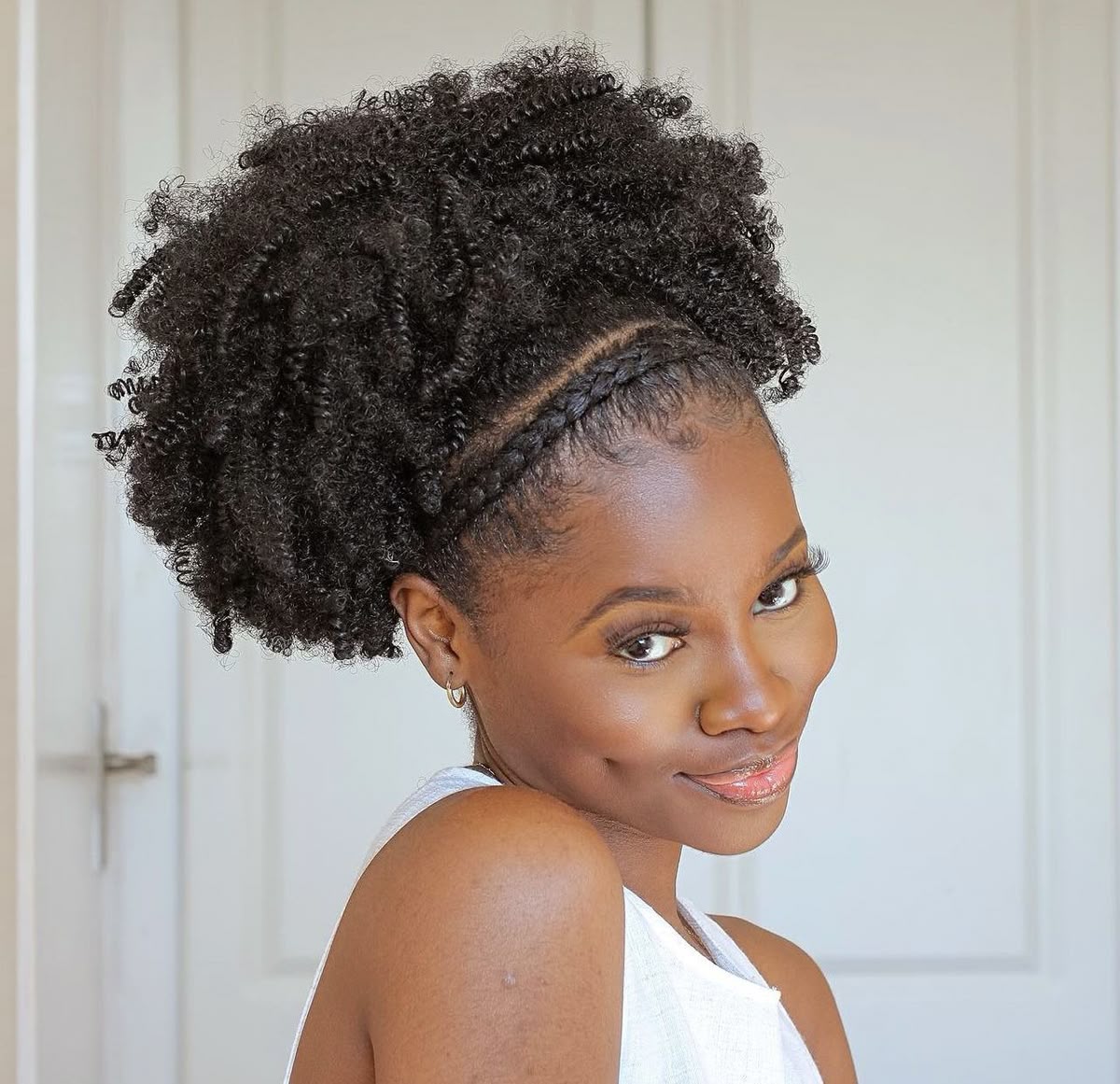 a girl with styled afro hair